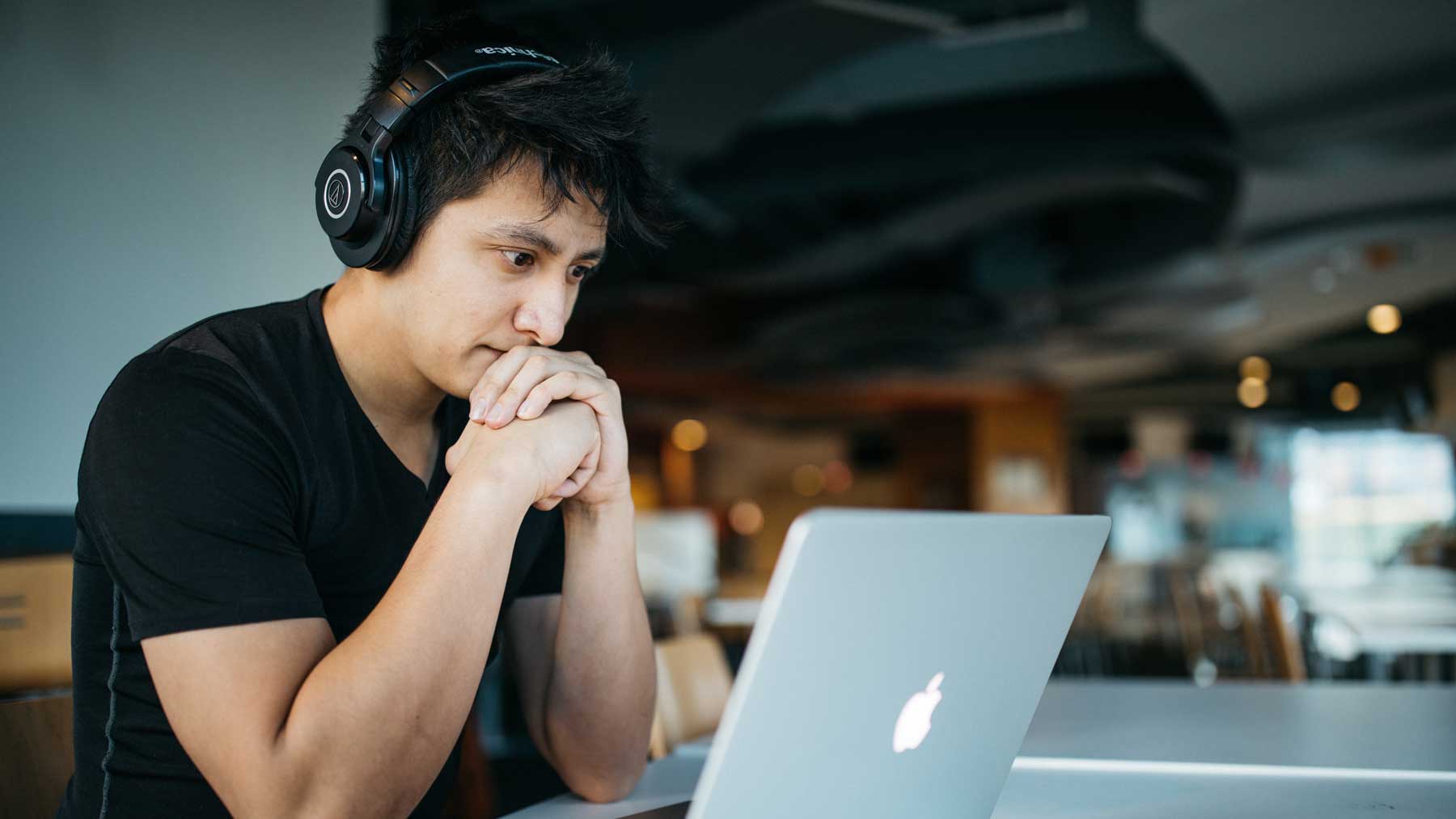 student with headphones taking an online class